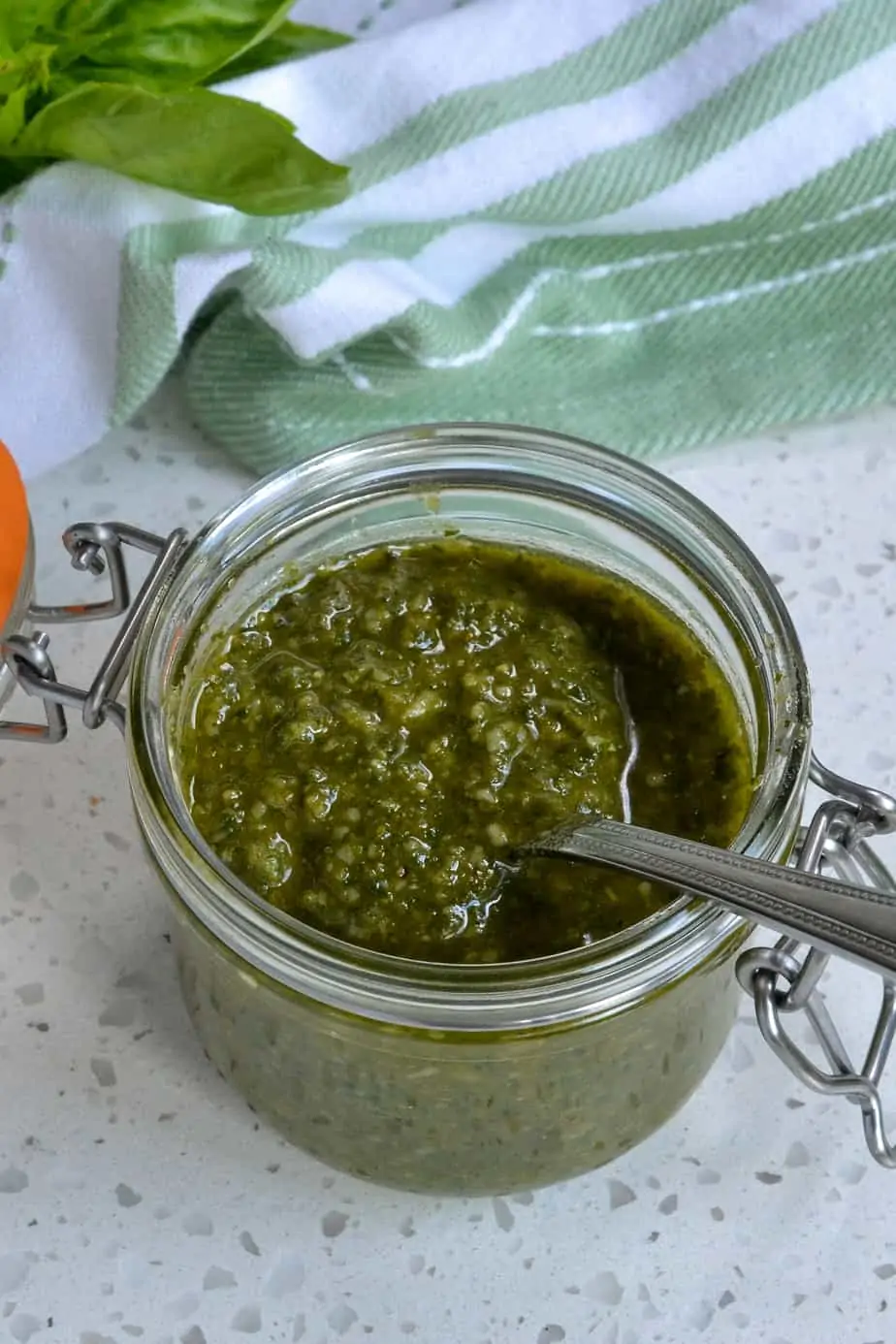 A jar of homemade pesto sauce. 