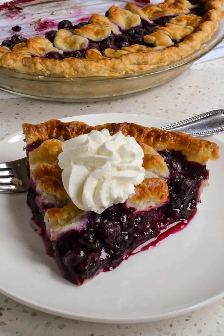 A slice of homemade blueberry pie