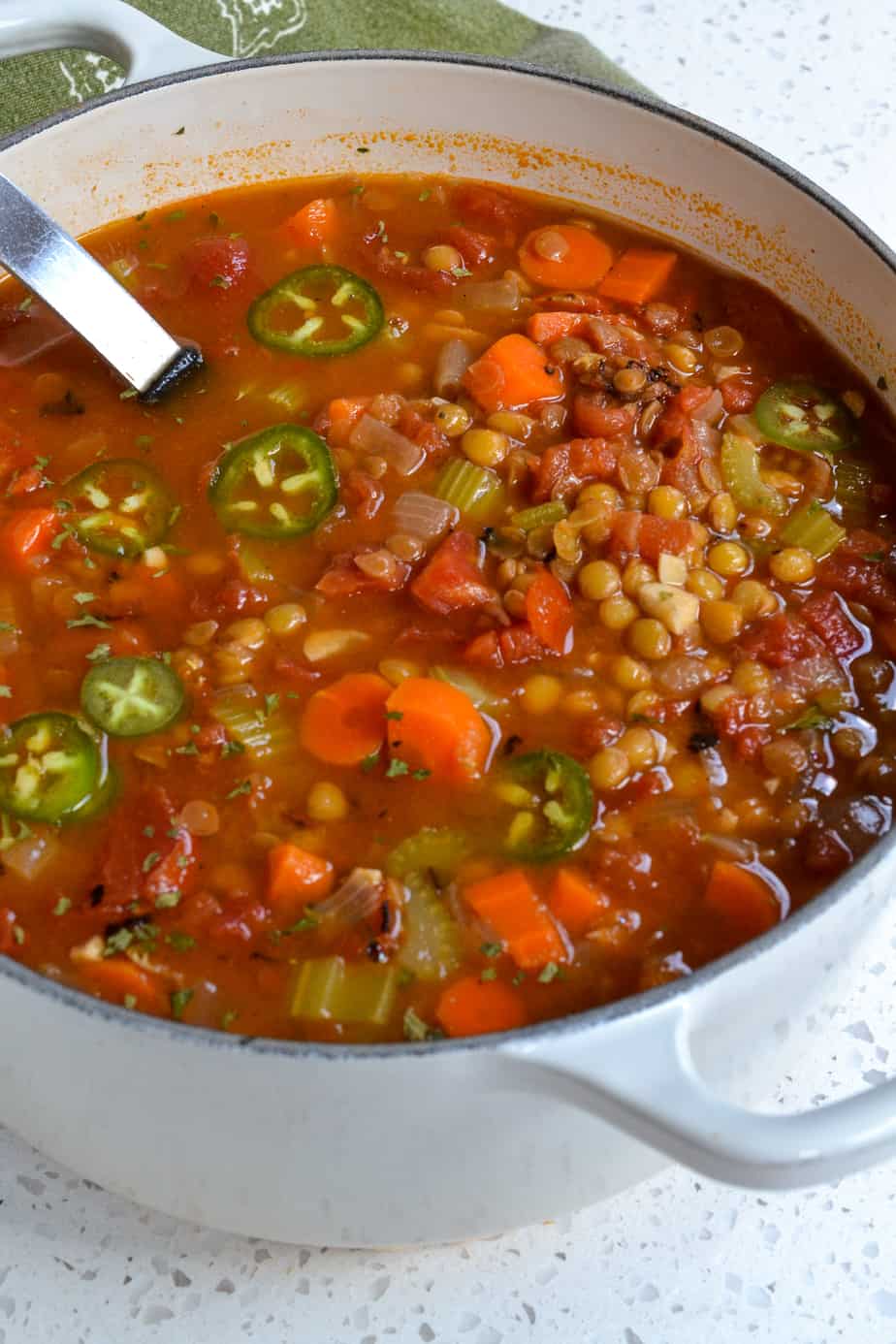 A pot of vegetable lentil soup.