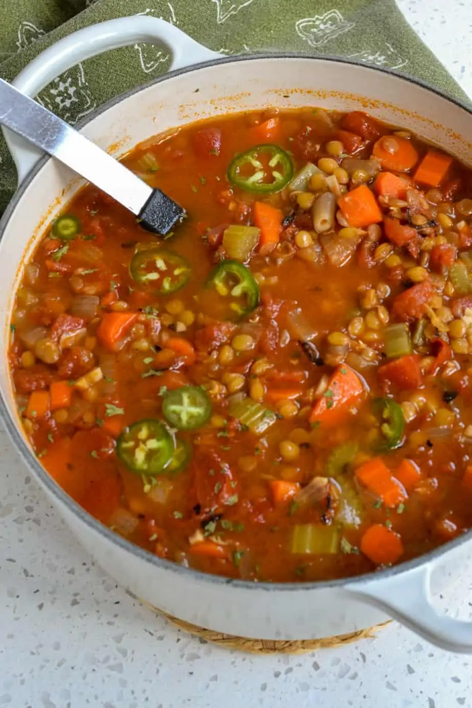 Fresh vegan lentil soup with carrots, onions, and celery. 