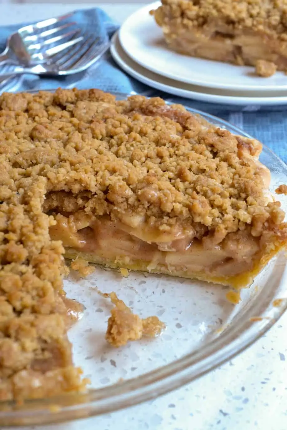 A classic Dutch Apple Pie Recipe with a flaky, buttery homemade pie crust, a perfect homemade apple pie filling with a touch of cinnamon, loads of crumb topping, and just the right balance of tartness and sweetness.