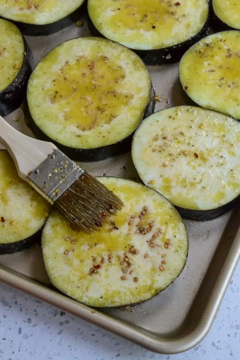 Brushed eggplant with olive oil and herbs. 