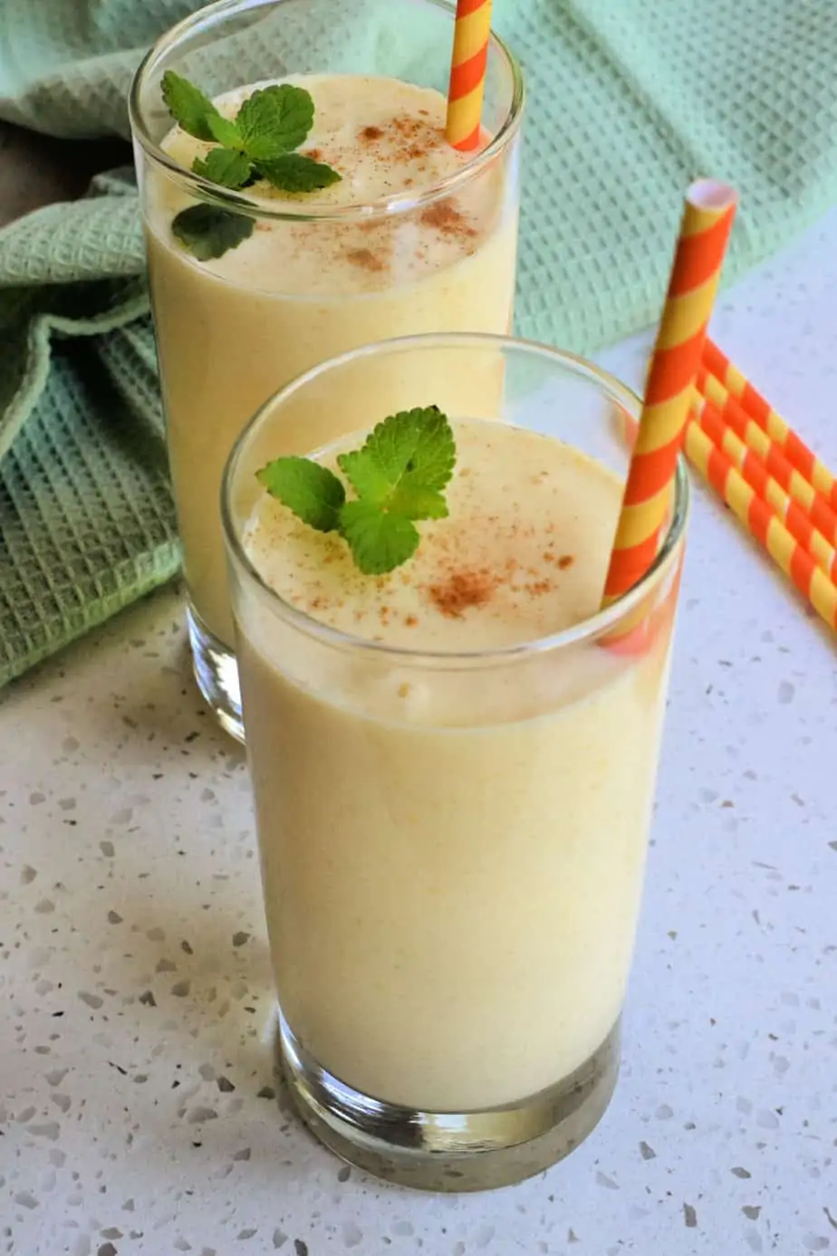 This quick and easy refreshing Mango Lassi is the perfect balance of sweet mangoes and tangy yogurt, made easy in a blender in less than ten minutes.  Enjoy them for a quick breakfast treat or dessert.  