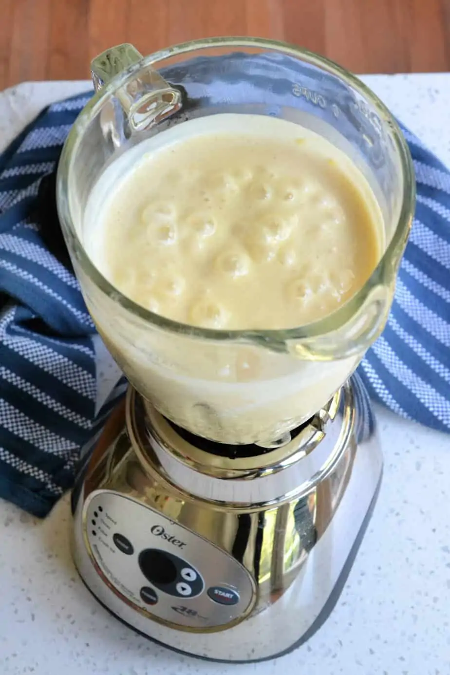 Simply put the mango, yogurt, milk, honey, and cardamom or cinnamon in a blender.  Then blend until smooth.