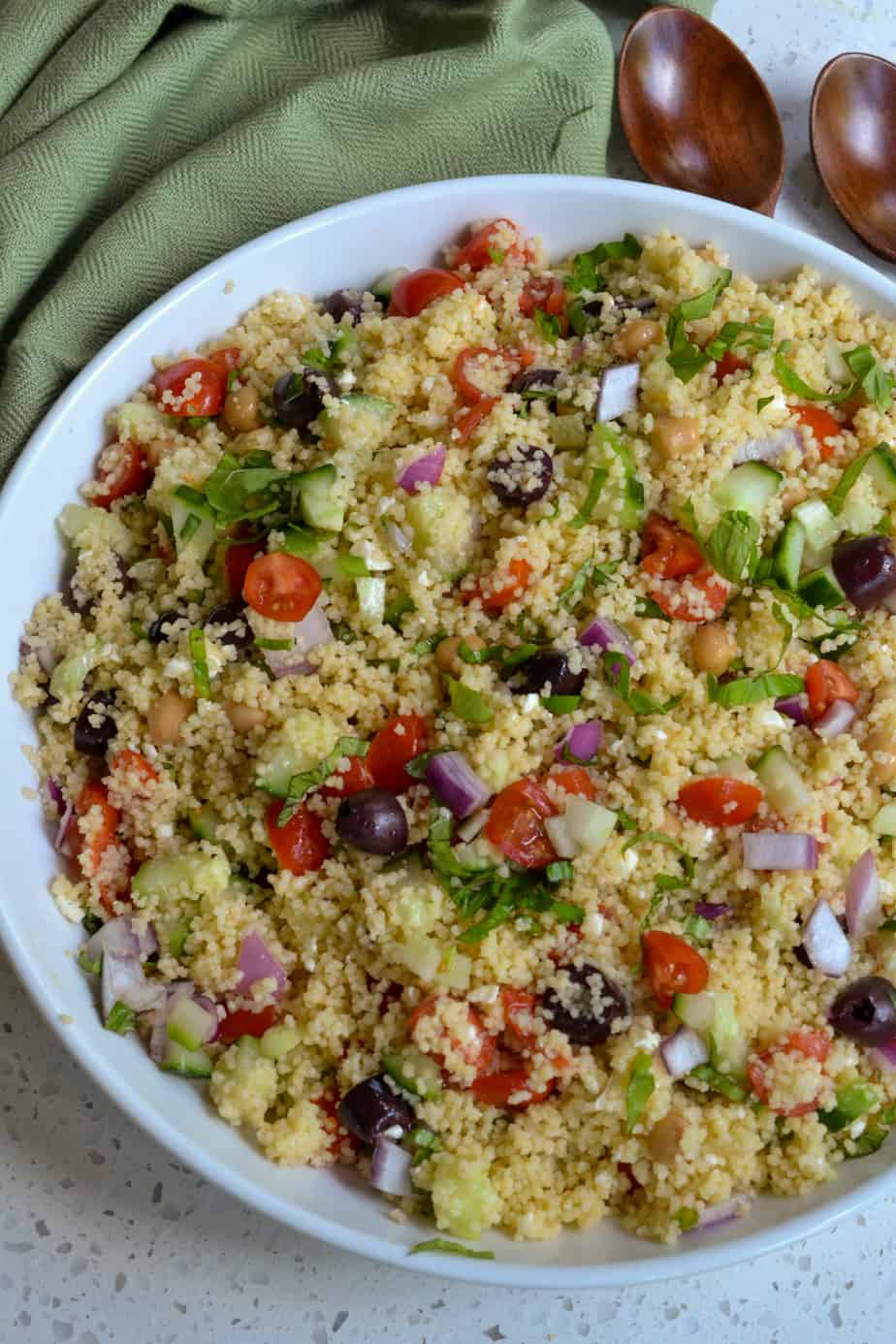 Couscous with cucumbers, tomatoes, olives, red onion, garbanzo beans and feta cheese. 