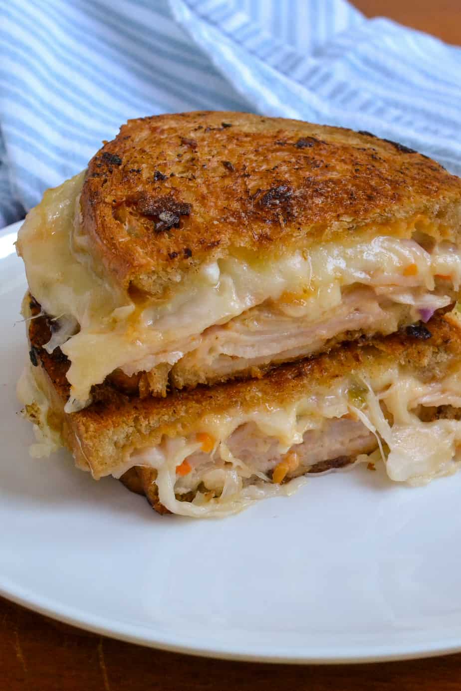 A double stacked Rachel Sandwich with turkey, Swiss and coleslaw