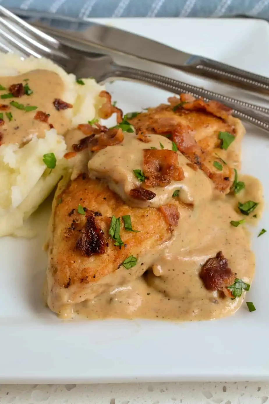 A plate of southern style smothered chicken with gravy