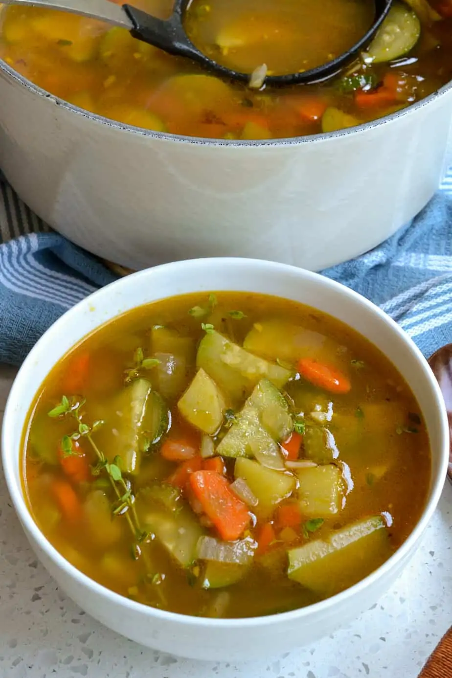 A bowl full of zucchini vegetable soup. 