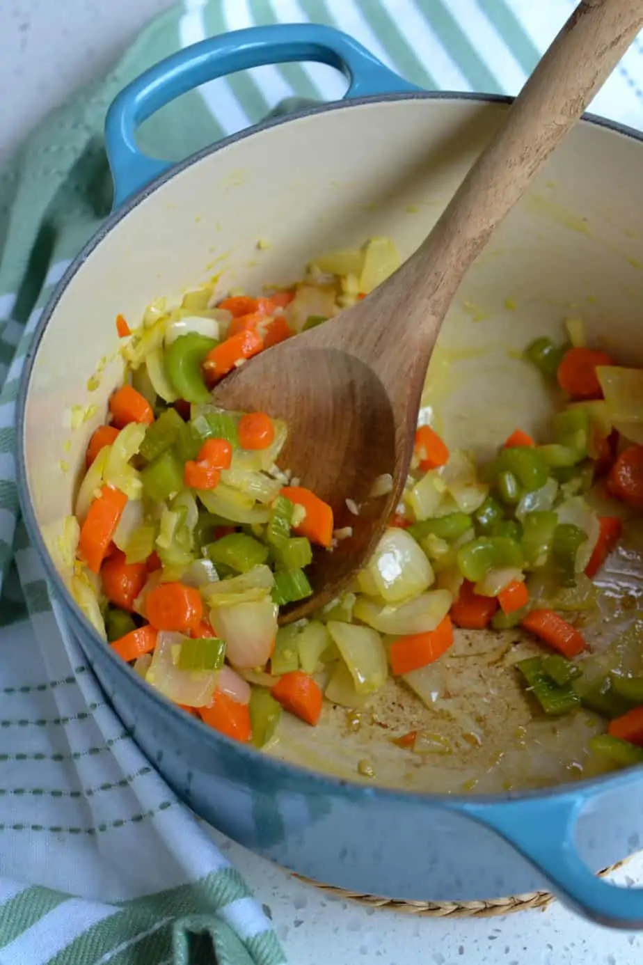 To make black bean soup first cook the onions and celery until soft. 