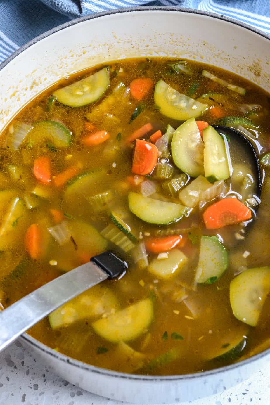 A pot full of zucchini vegetable soup. 