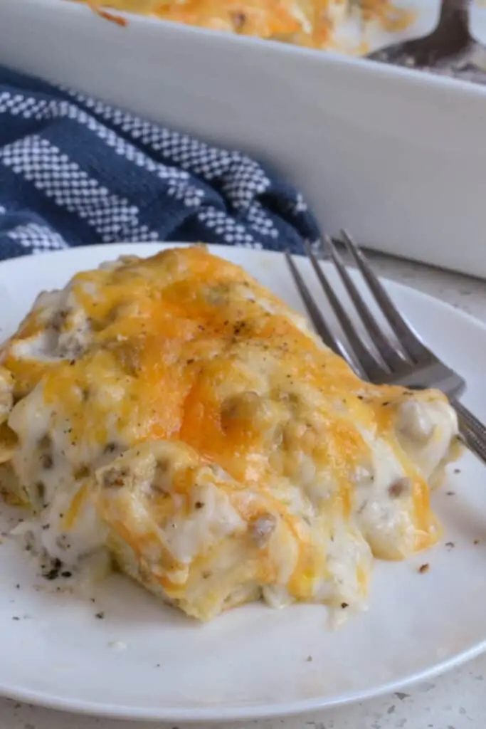 A plate full of hot biscuits and gravy casserole. 