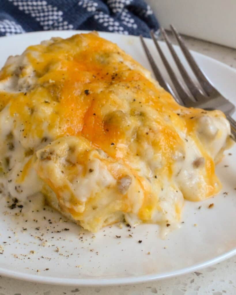 Biscuits and Gravy Casserole combines fluffy biscuits, breakfast sausage, eggs, Colby cheese, and white sausage gravy.