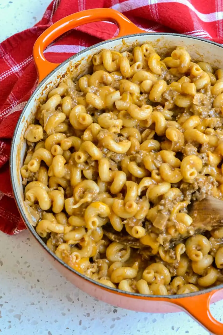 If you use a Dutch oven for the pasta portion of the recipe, you do not need to transfer it to a casserole dish because they are oven safe.