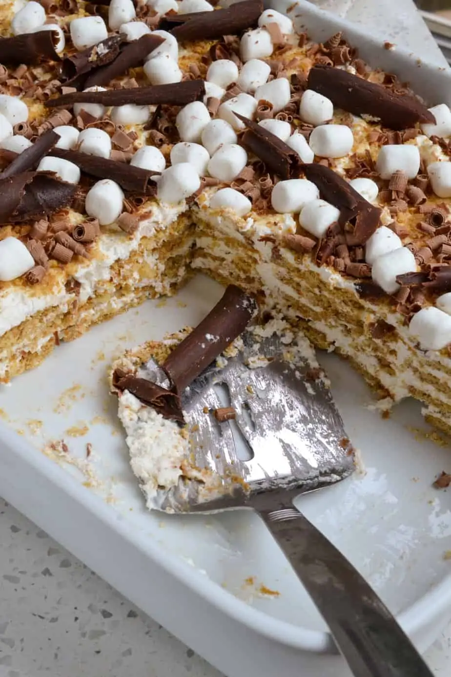 A pan full of Icebox Cake made with graham crackers and whipped cream. 