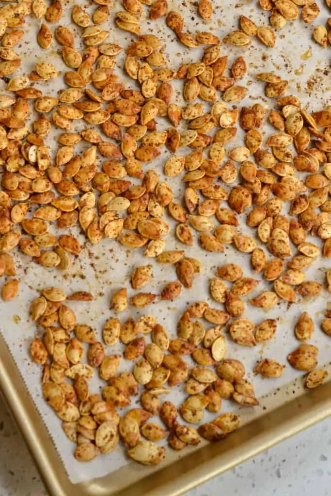 A baking sheet full or Cajun roasted pumpkin seeds. 