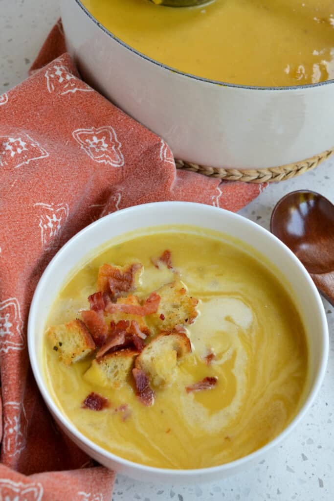 Pumpkin soup with whipped cream, homemade croutons, crisp bacon, and pumpkin seeds. 