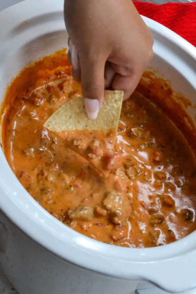 A crock full of Rotel Sausage Dip