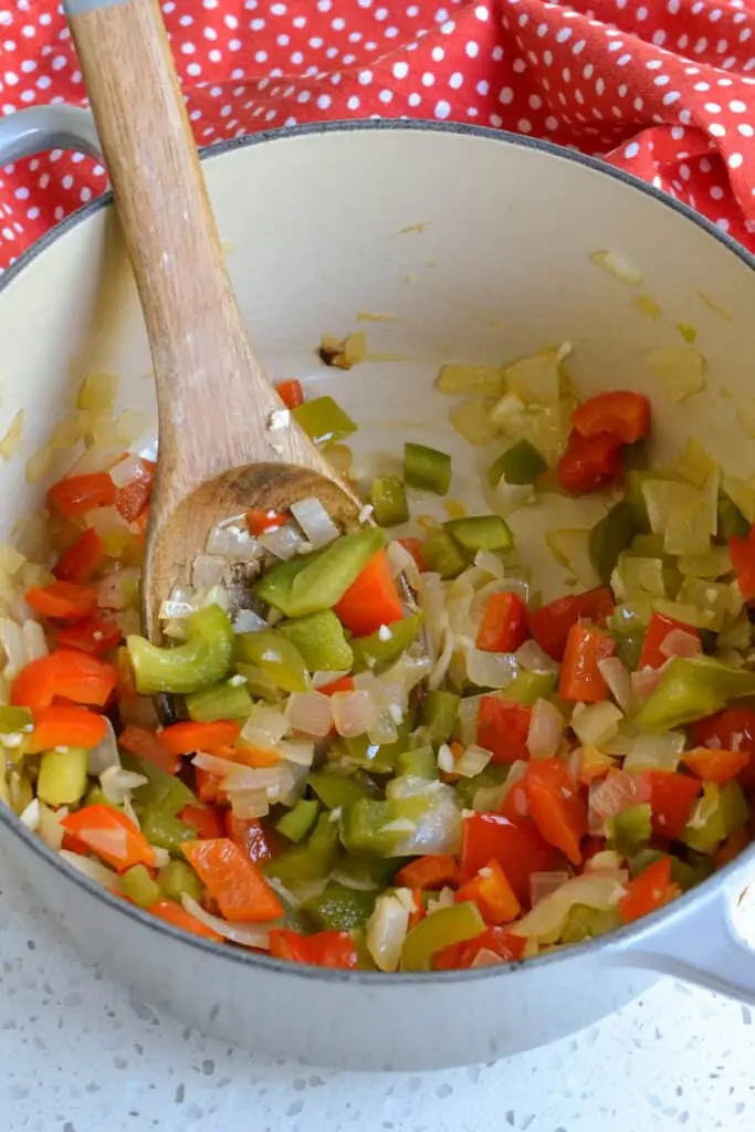 Cook the onions, red and green bell peppers until soft. 