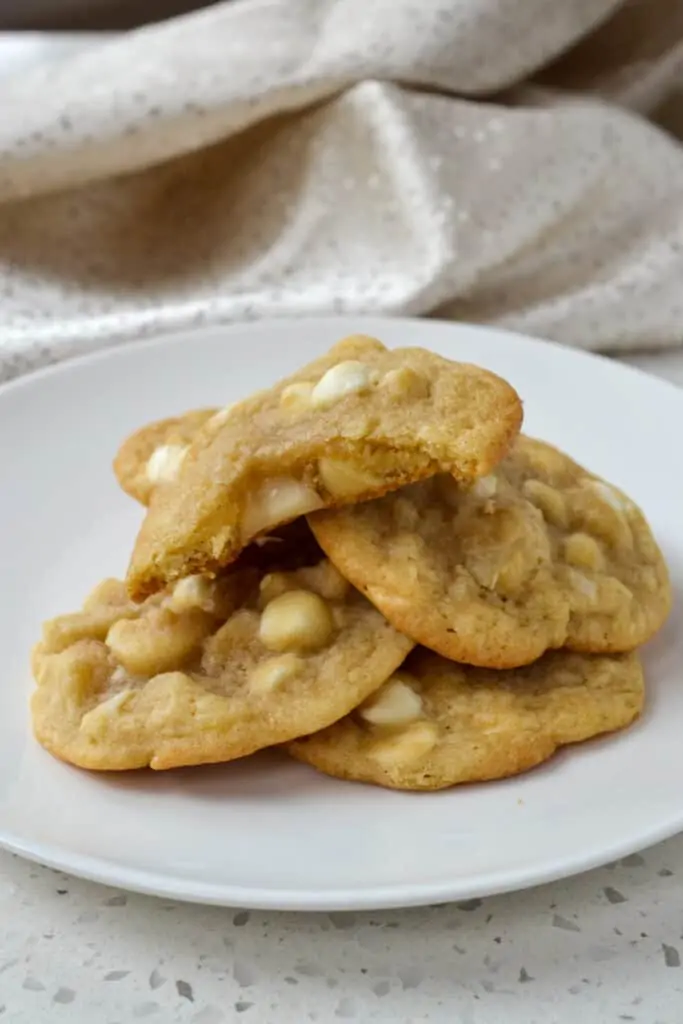 A plate full of macadamia nut cookies. 