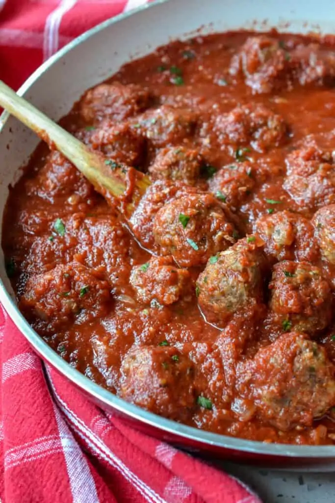 These easy homemade Baked Meatballs with fresh marinara are so much better than store-bought meatballs with a combination of ground beef, Italian sausage, panko breadcrumbs, fresh Parmesan cheese, and fresh parsley.