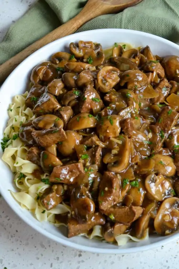 Tender beef with mushrooms and gravy  over egg noodles. 
