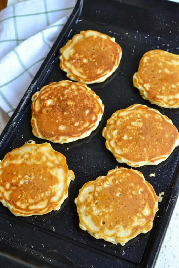 Oatmeal pancakes on a griddle. 