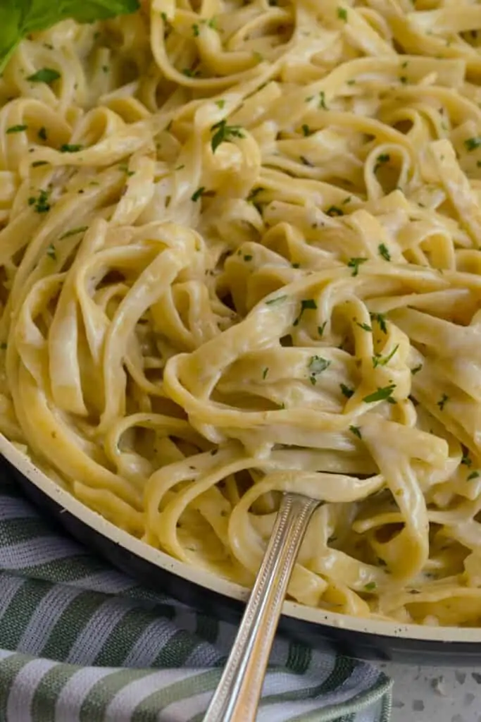 Creamy homemade alfredo sauce with a sprinkle of Italian parsley