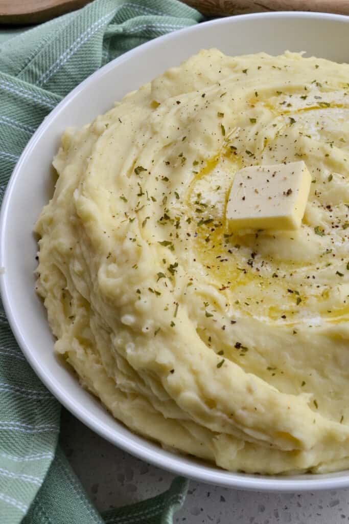 A bowl full of instant pot mashed potatoes. 