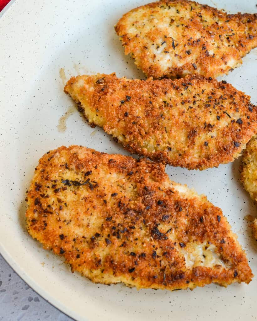Parmesan Crusted Chicken in a pan.