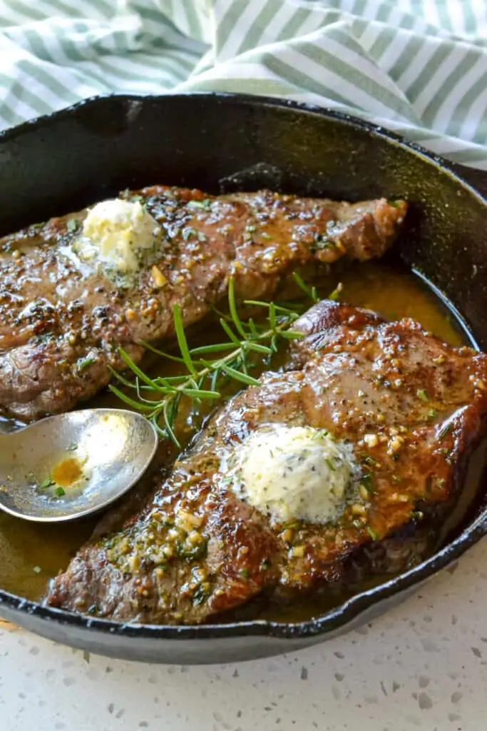 New York strip steak topped with garlic herb butter. 