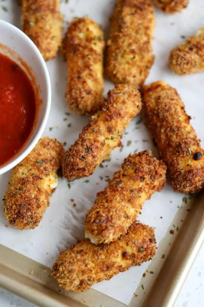 These easy Air Fryer Mozzarella Sticks are panko-breaded mozzarella string cheese cooked to crispy perfection in about five minutes in an air fryer, also known as a convection oven. 