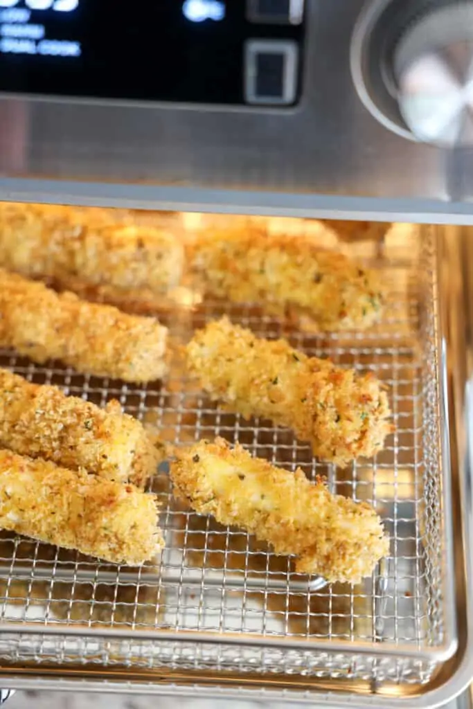 Cook mozzarella sticks in the air fryer for about 5 minutes.  