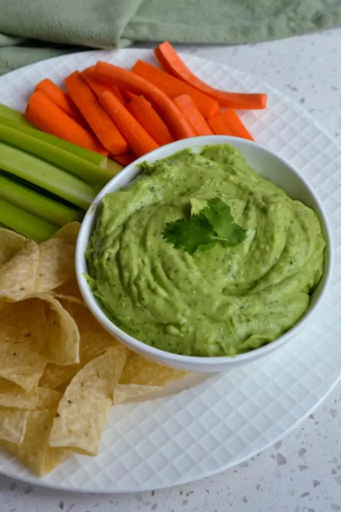 A tasty Avocado Dip or spread made quickly and easily in the food processor in less than ten minutes.  Enjoy it with fresh tortilla chips, carrot sticks, celery sticks, cucumbers, radishes, and bagel chips. 