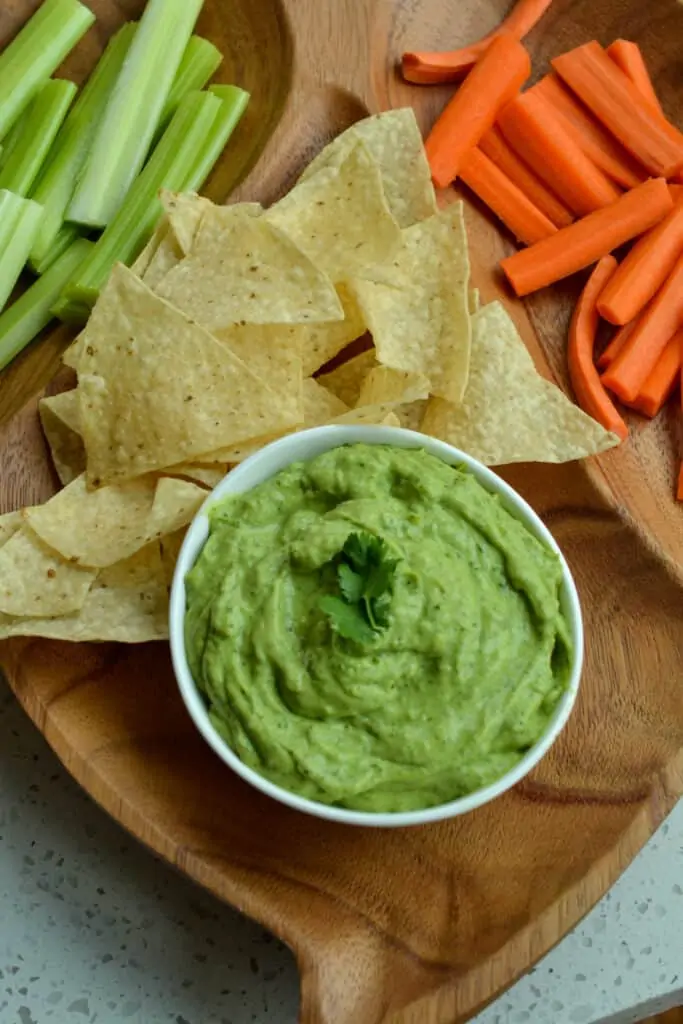 Eat avocado dip as a snack with tortilla chips, crackers, carrot sticks, celery sticks, and bell peppers.  It tastes delicious as a spread on sandwiches, nachos, tortillas, fajitas, burritos, eggs, enchiladas, and tacos. 