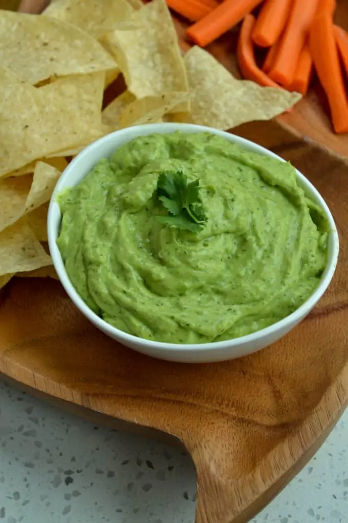 This beautiful, tasty eight-ingredient, rich, and creamy Avocado Dip is always a family and friend party favorite.