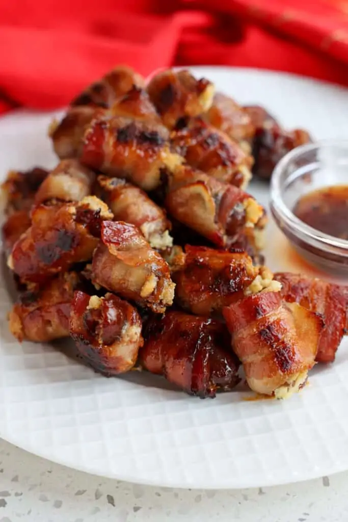 A plate full of bacon wrapped dates.