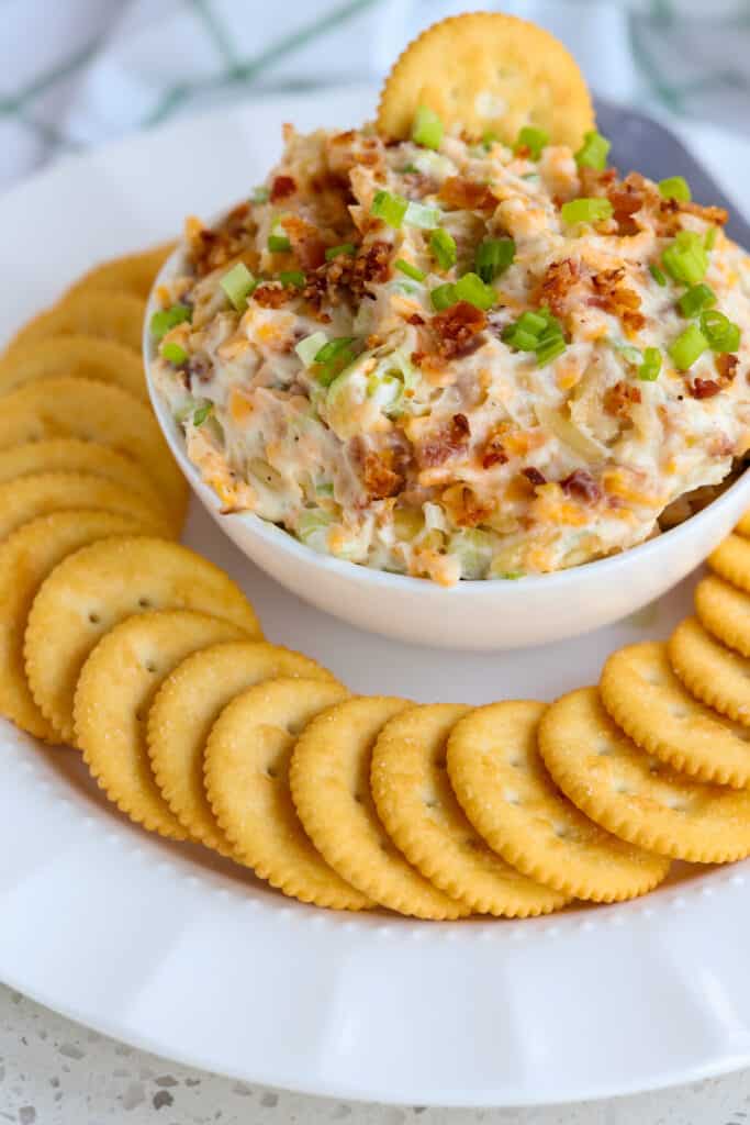 Million Dollar Dip on a platter served with buttery crackers. 