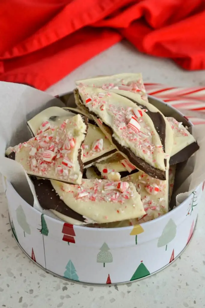 Homemade chocolate Christmas candy in a Christmas tin. 