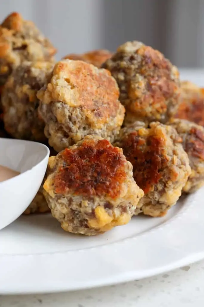 With just eight simple ingredients, these sausage balls are ready for the oven in about fifteen minutes. 