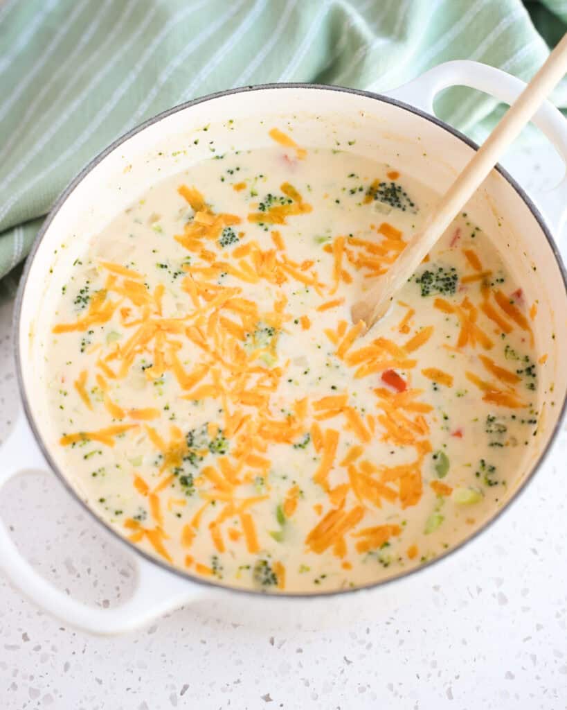 A Dutch Oven full of broccoli cheese soup