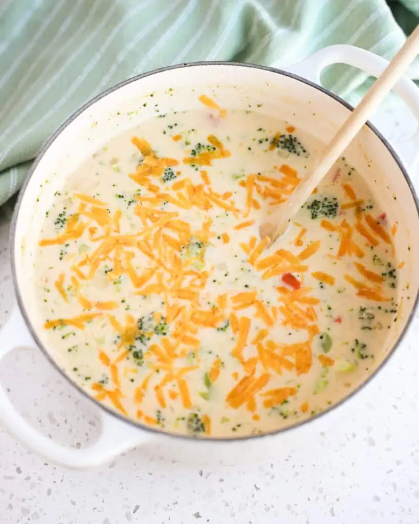 A Dutch Oven full of broccoli cheese soup