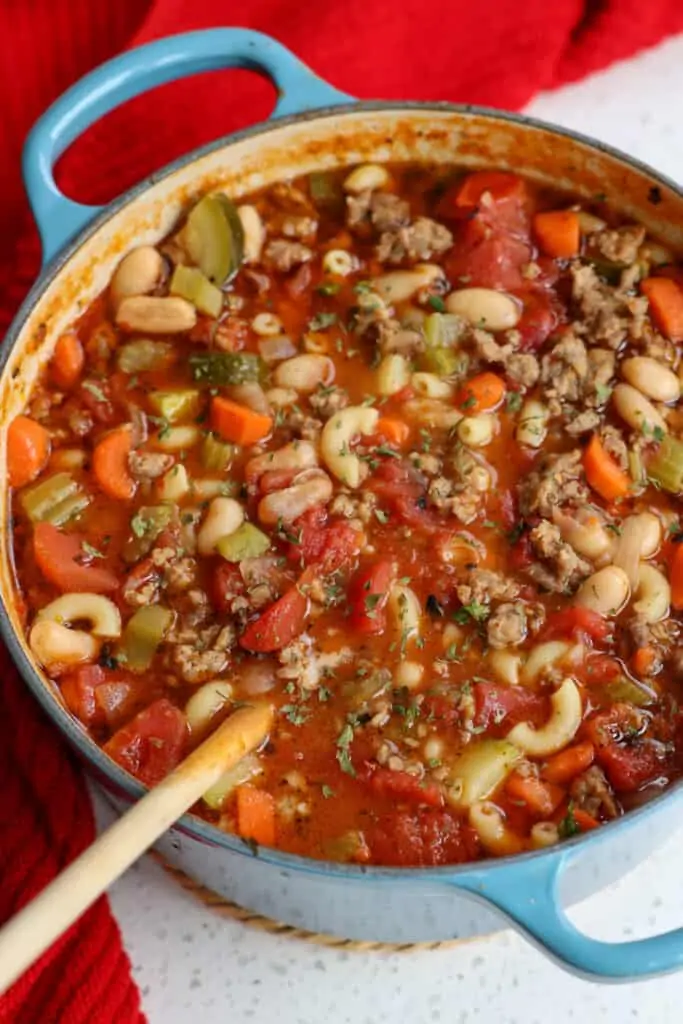 A Dutch Oven full of homemade Italian Sausage Soup. 