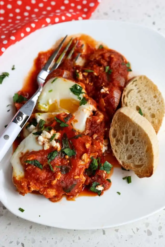 Gently poached eggs simmered in onions, peppers, garlic, and crushed tomatoes with spices. 