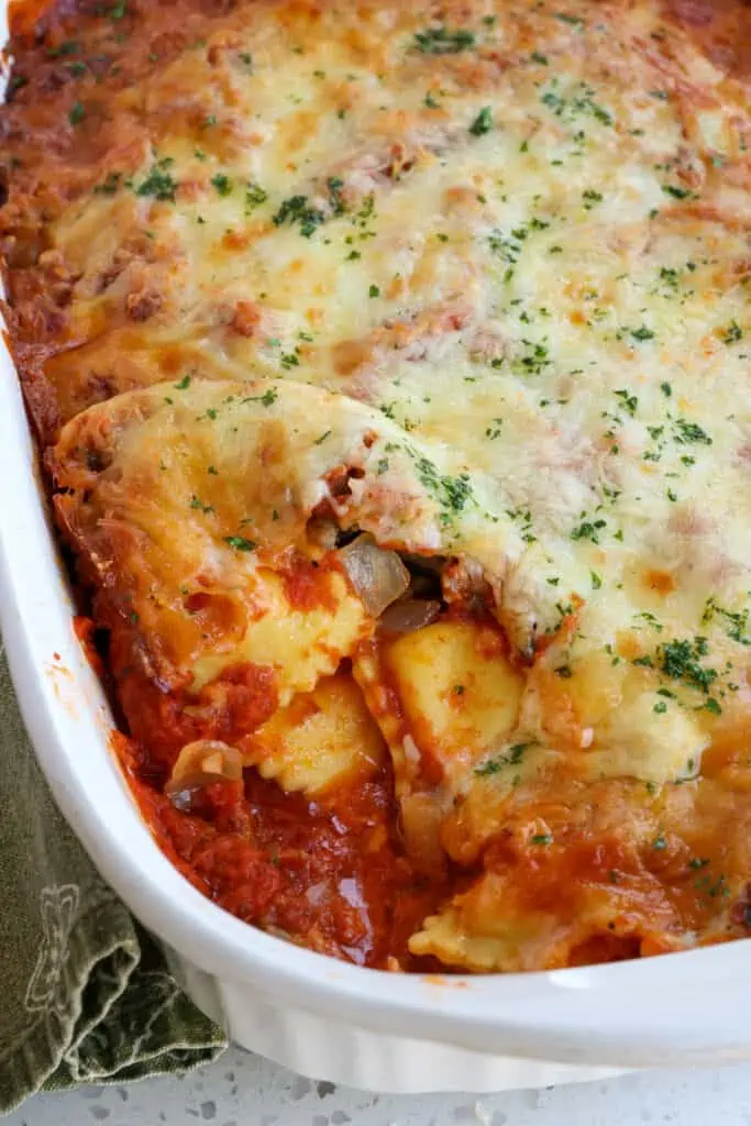 Baked ravioli casserole with Italian Sausage, onions, garlic, marinara, mozzarella, and Parmesan Cheese. 