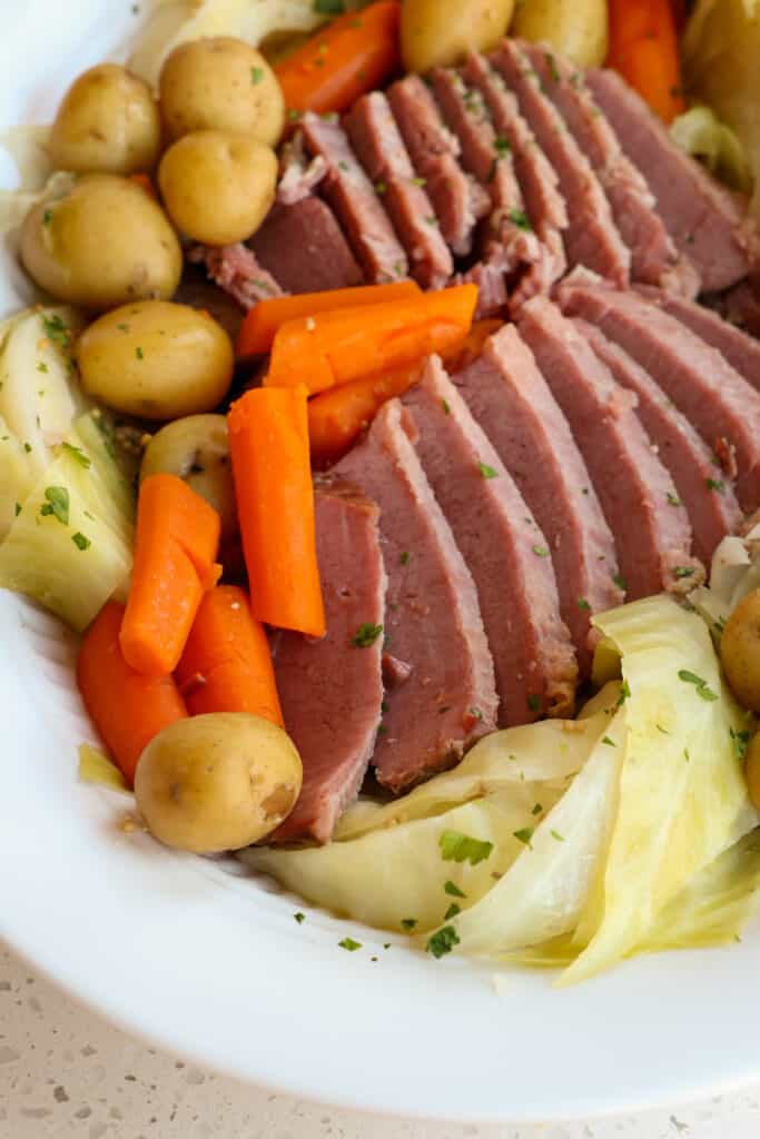 Traditional corned beef and cabbage with cabbage, potatoes, and carrots. 
