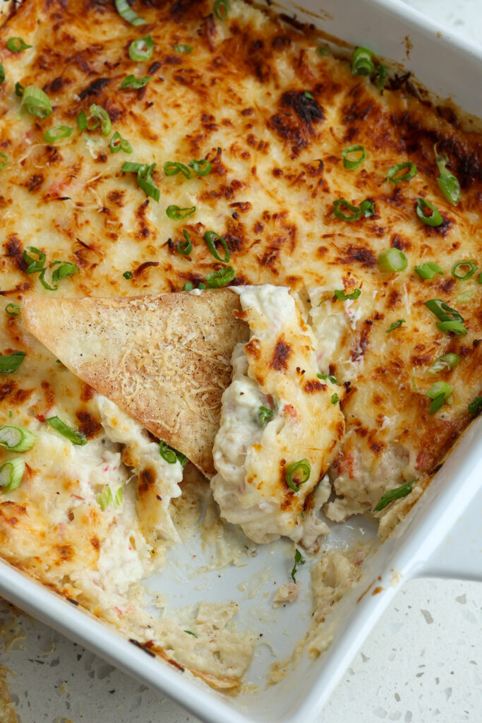 The ultimate creamy Crab Rangoon Dip Recipe is made with succulent crab meat, cream cheese, mozzarella, mayonnaise, sour cream, and a few simple pantry spices.  