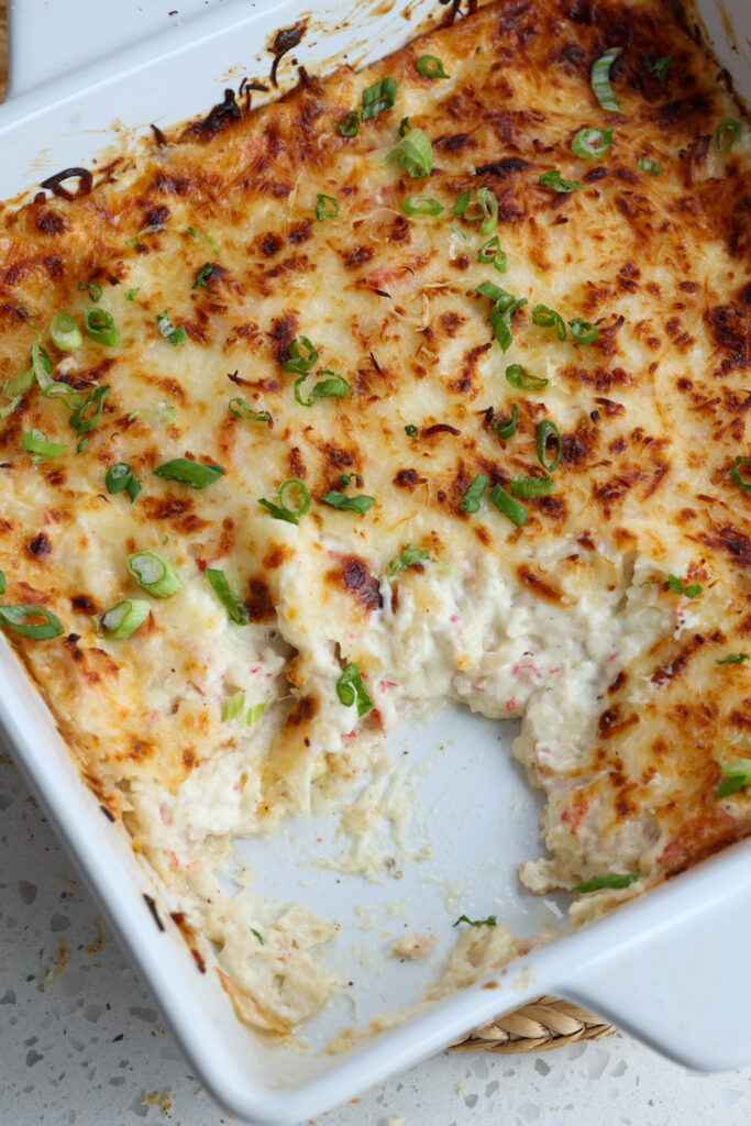 An easy to make Crab Rangoon dip made with cream cheese, mozzarella, and crab meat all baked up to golden perfection.  For an over the top taste treat serve with homemade wonton chips. 