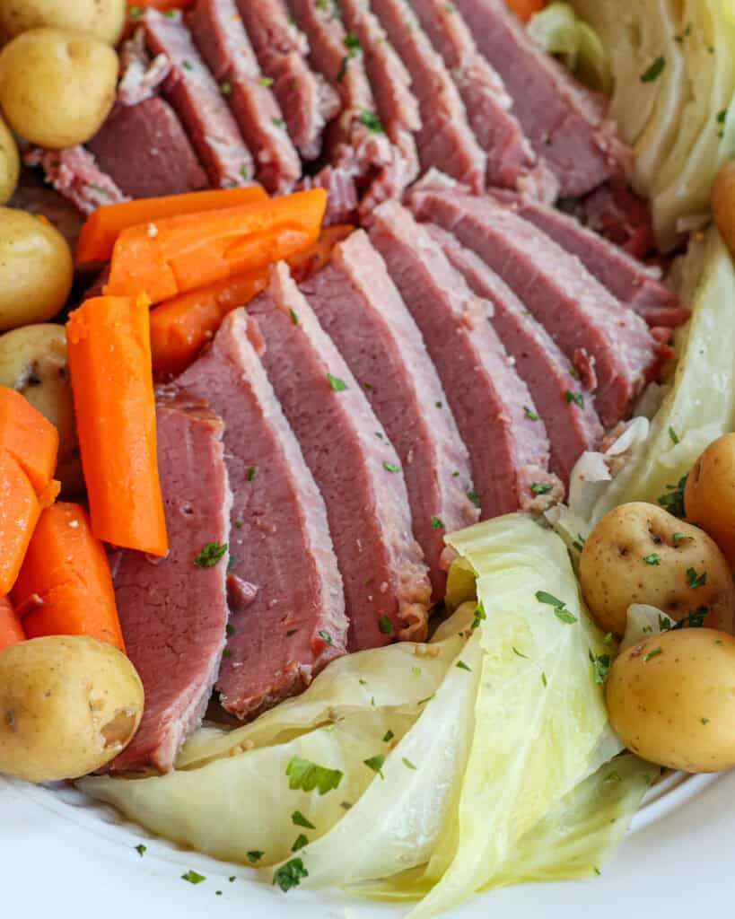 Traditional Corned Beef and Cabbage Recipe Traditional corned beef and cabbage with cabbage, potatoes, and carrots.