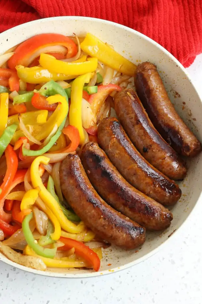 Brown the sausage over medium heat in a skillet. 