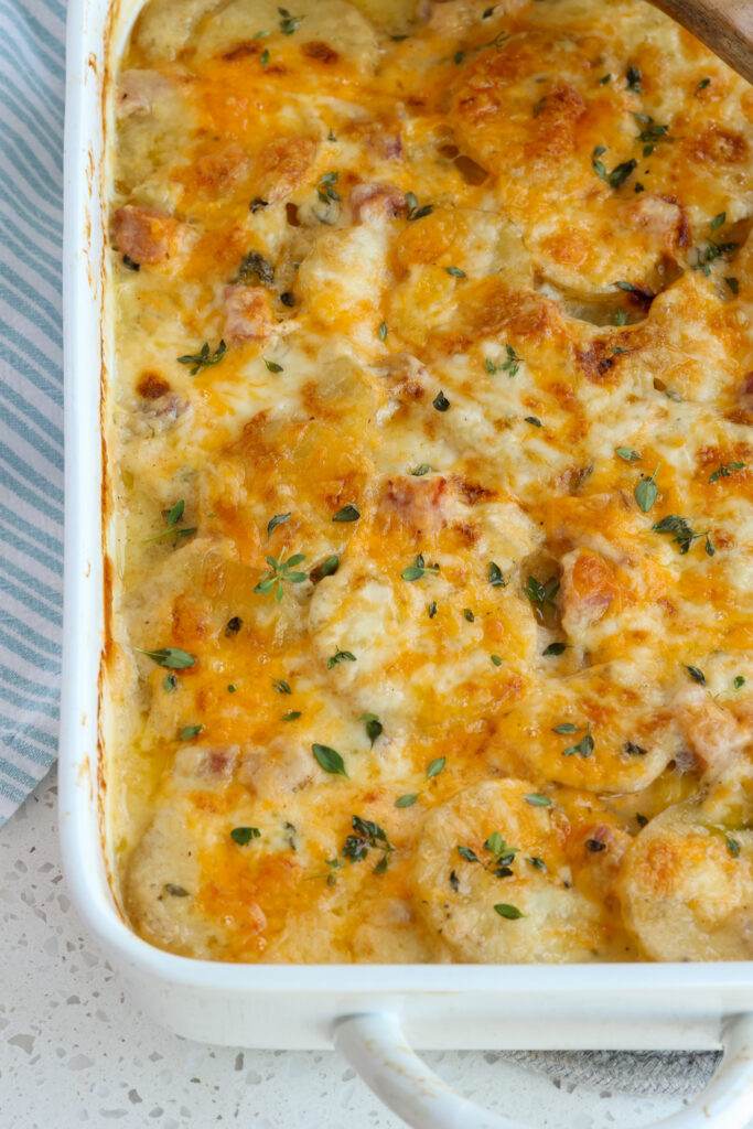 A casserole full of ham and scalloped potatoes. 